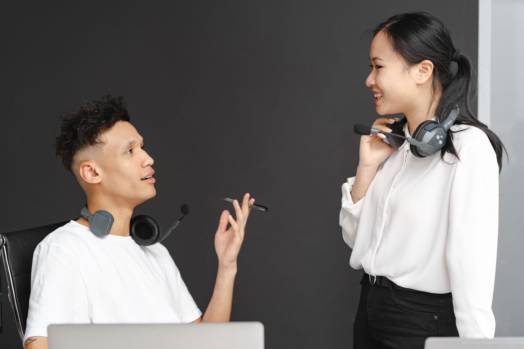 Two colleagues talking in a modern open-plan office