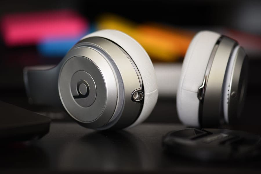 Metal-framed over-ear headphones photographed against a plain background