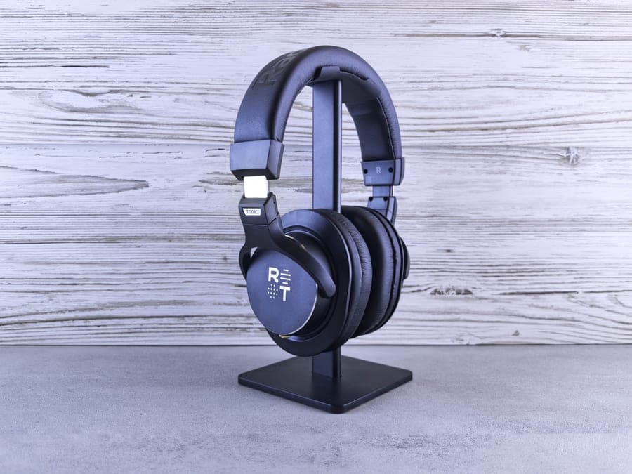 Black over-ear noise canceling headphones on a light background