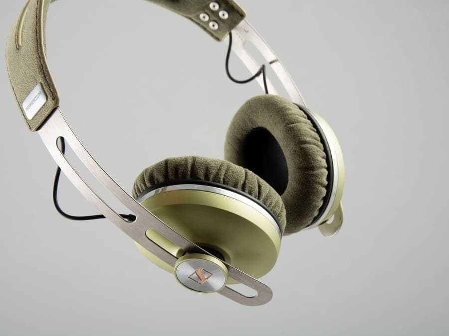 On-ear headphones with a slim metal headband on a neutral background