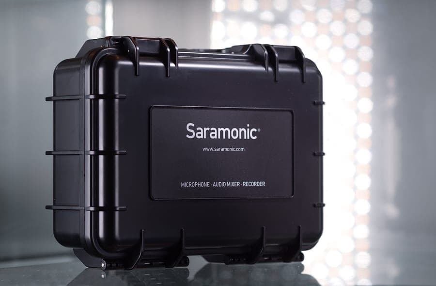 A black hard-shell protective case for audio equipment on a surface
