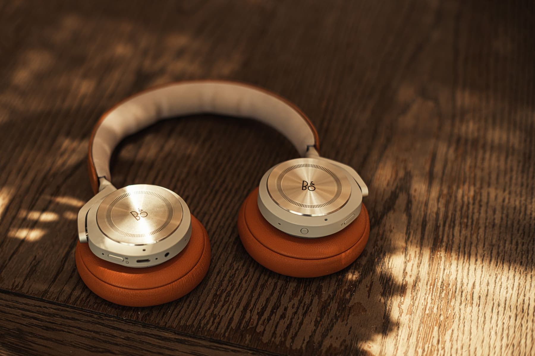 Premium over-ear headphones resting on a marble surface